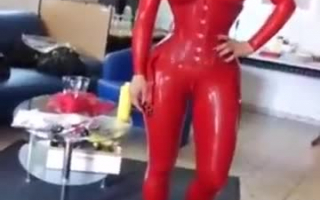 Cute latex girl takes a huge monster smile on her face at work today